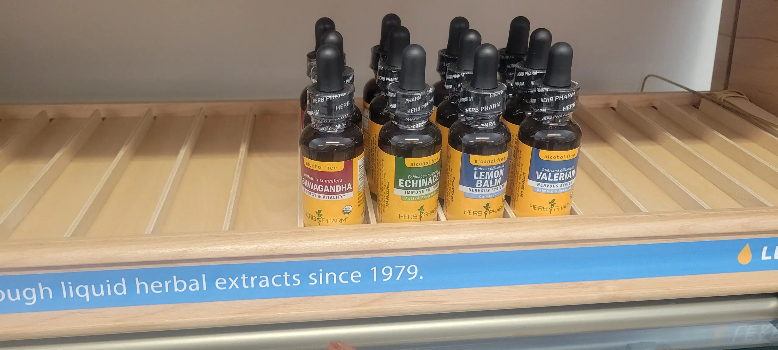 Bottles of hemp extracts displayed on a shelf.