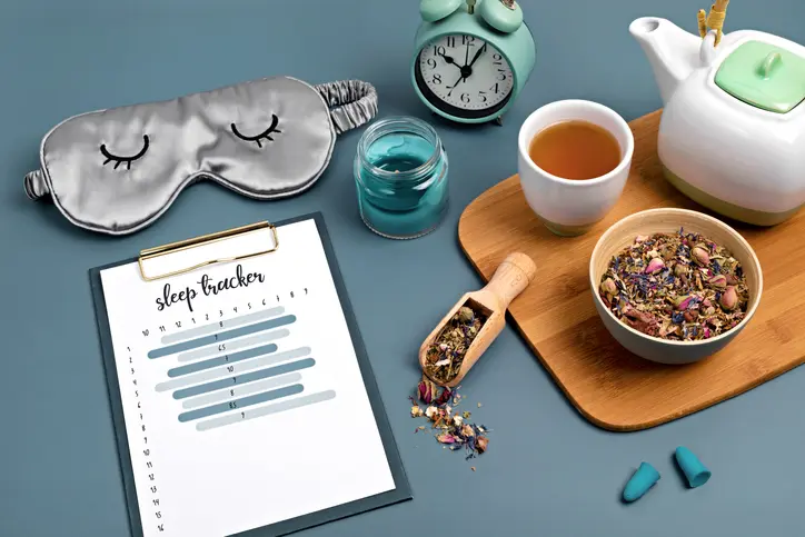 Sleep tracker with tea and relaxation items.