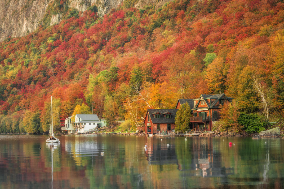 Autumn foliage reflecting on tranquil water.